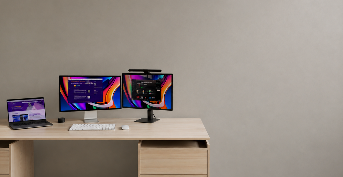 LG laptop with dual LG monitors displaying digital content on a desk