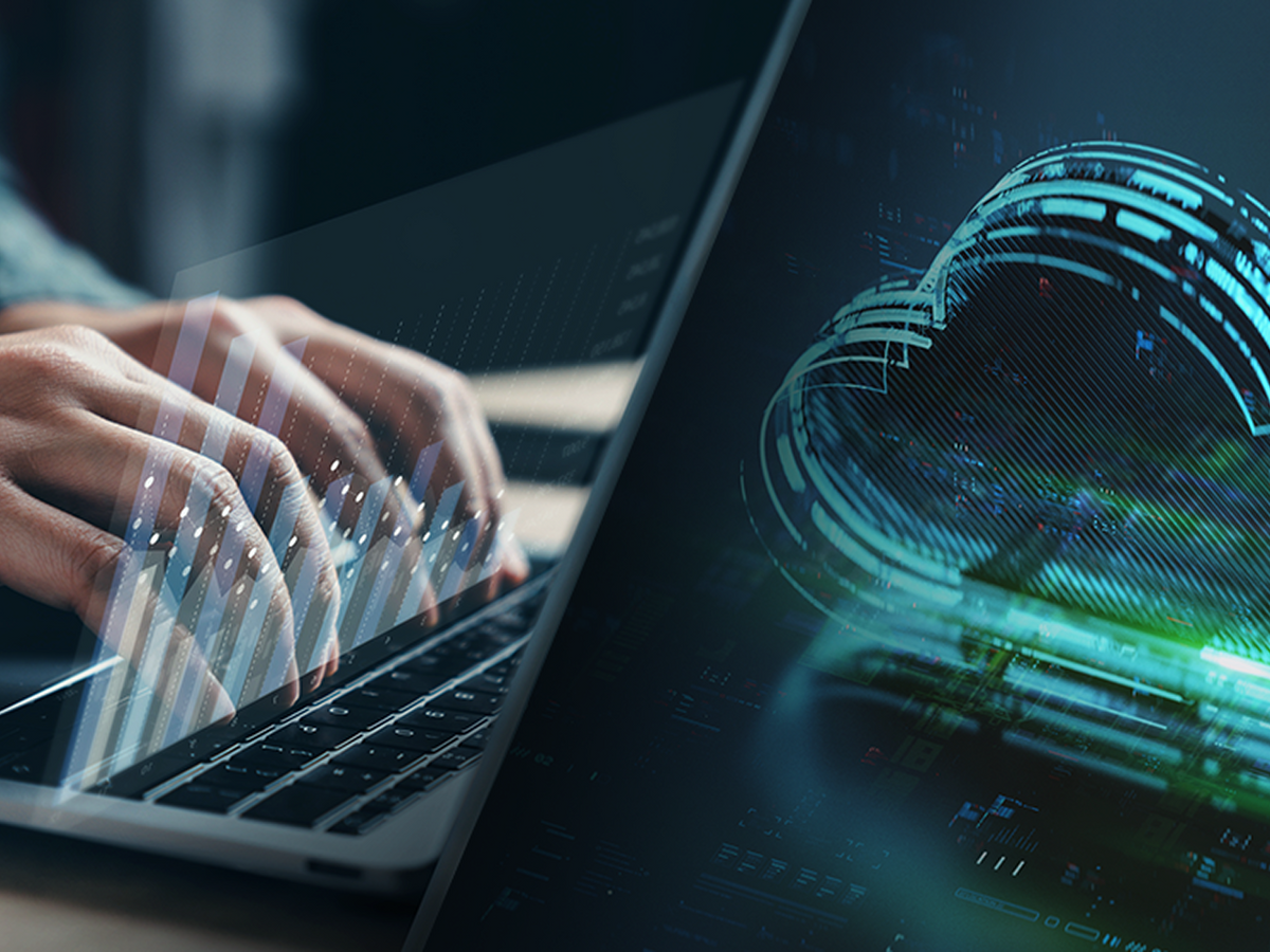 Close-up of hands typing on a laptop with overlaid bar graphs alongside a digital cloud computing visualization.