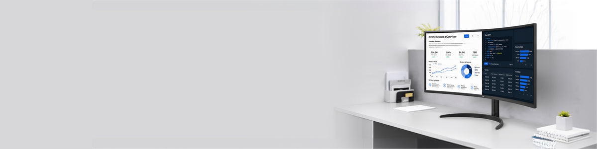 LG 34CR651W curved monitor displaying performance dashboards and data analytics on an office desk.