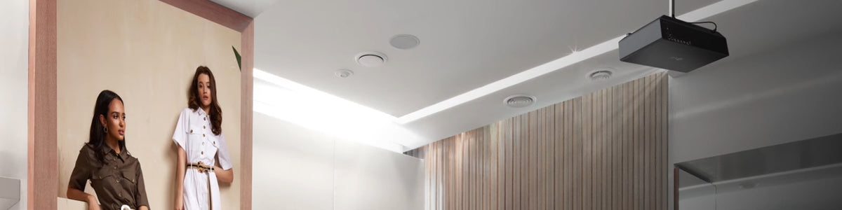 LG projector installed on the ceiling of a retail store